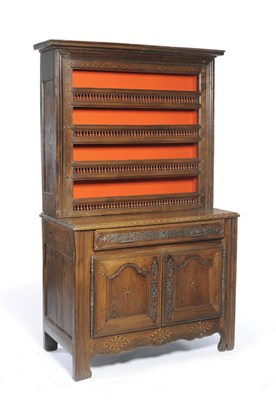 Lot 1401 - An 18th Century Continental Oak Dresser and Rack, the projecting cornice above a brass studded...