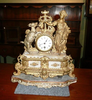 Lot 355 - A gilt metal and alabaster figural mantel clock