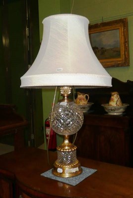 Lot 356 - A large cut glass and gilt metal table lamp and shade.