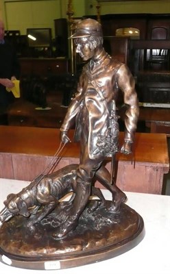 Lot 359 - A modern bronzed figure of a gentleman with dog