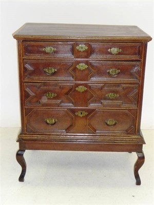 Lot 1402 - An Early 18th Century Joined Oak Chest on Stand, the moulded top over four long geometrically...