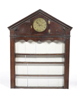 Lot 1407 - A George III Oak Delft Rack, the architectural pediment above a brass circular clock face inscribed