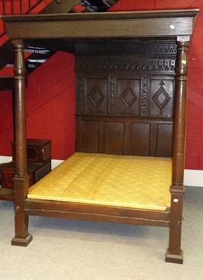 Lot 1408 - An Oak Tester Bed, the panelled tester with lunette carved border and lozenges within plain moulded