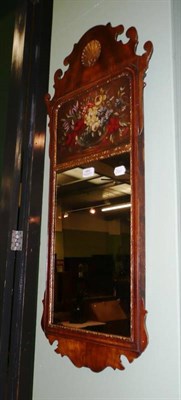 Lot 464 - A Georgian style walnut fret-carved wall mirror with frieze painted with a bowl of flowers