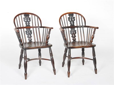 Lot 1412 - A Pair of 19th Century Nottinghamshire Yew and Elm Windsor Chairs, the arched backs with carved and