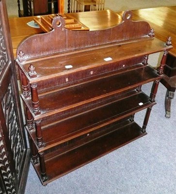 Lot 497 - A set of four tier mahogany wall shelves