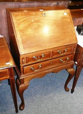 Lot 501 - Georgian style walnut small bureau on cabriole legs