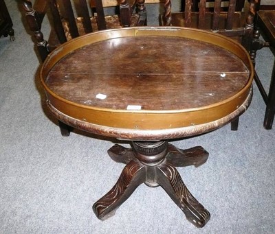 Lot 516 - Oak pedestal table with an oval copper-galleried top