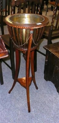 Lot 518 - An Edwardian inlaid mahogany jardiniere with brass liner