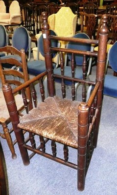 Lot 522 - Oak spindle back chair with rush seat