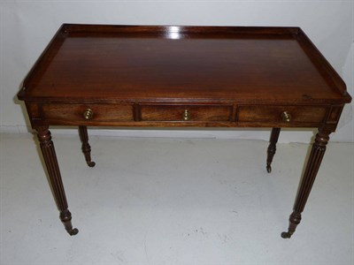 Lot 1418 - A Mahogany Writing Table, mid 19th century, the rectangular top with reeded edge and...