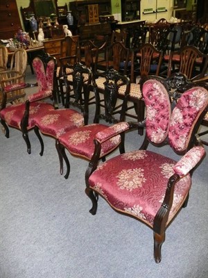 Lot 530 - Four ebonised mahogany chairs