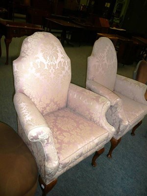 Lot 539 - Pair of wingback chairs upholstered in pink