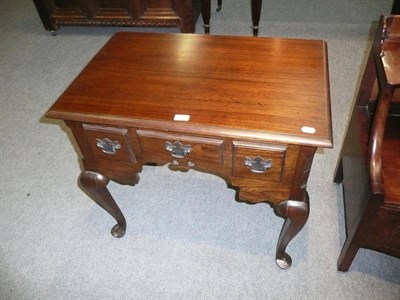 Lot 544 - A reproduction lowboy