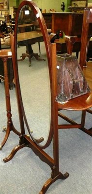 Lot 558 - Mahogany cheval glass with oval plate and a carved oak stick stand of flared square form