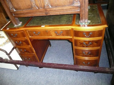 Lot 566 - A reproduction yew wood desk