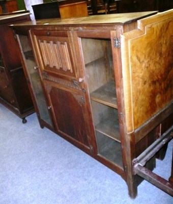 Lot 567 - An oak glazed secretaire cabinet