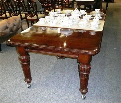 Lot 583 - Victorian mahogany dining table with two leaves, winder and heat pads