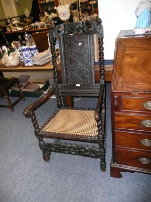 Lot 593 - Restoration style armchair and a joined oak armchair (a.f.)