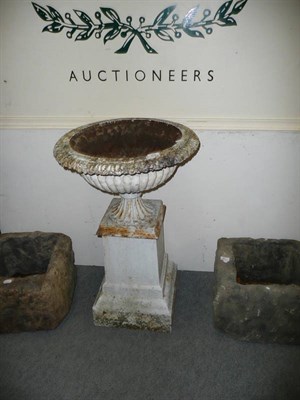 Lot 602 - A Victorian cast iron urn on a square plinth column