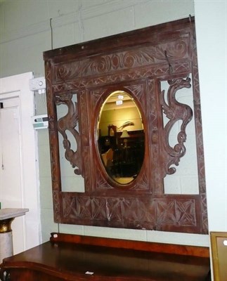 Lot 581A - A carved oak mirror/coat rack