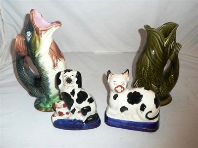 Lot 19 - Two Staffordshire figures and two gurgle fish jugs