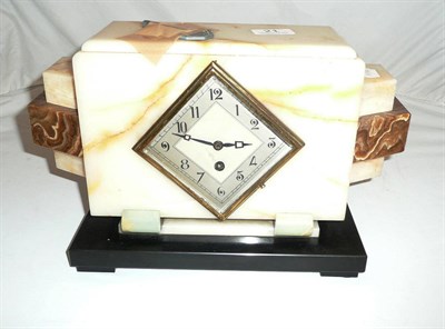 Lot 21 - An Art Deco onyx-cased mantel clock