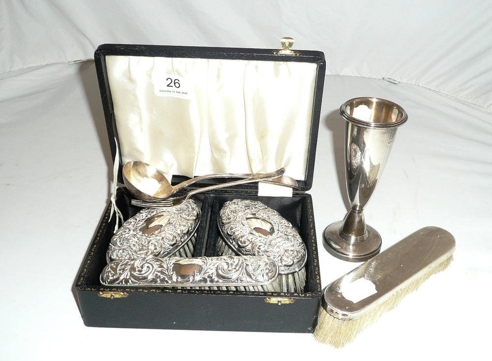 Lot 26 - A silver pedestal vase, a silver-backed clothes brush, a silver sauce ladle and dessert fork...