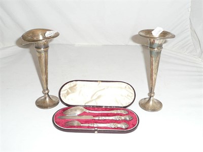 Lot 30 - A cased silver Christening set and a pair of loaded silver vases