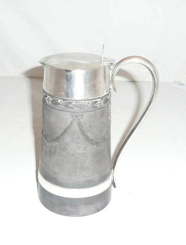 Lot 33 - A Wedgwood black basalt hot water jug with silver mounts and hinged cover, Sheffield 1880