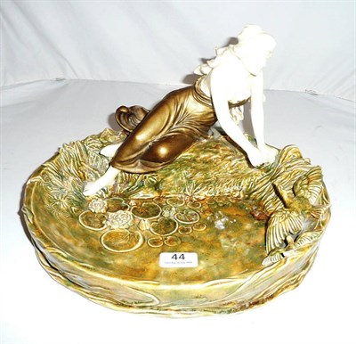 Lot 44 - Continental pottery group of a maiden feeding birds