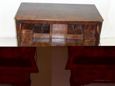 Lot 1434 - An Oak and Walnut Secretaire Chest, the rectangular top above three long graduated drawers, the top