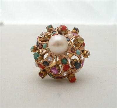 Lot 62 - A multi-gem-set cluster ring, the stones including coral, sapphire, turquoise, ruby and...