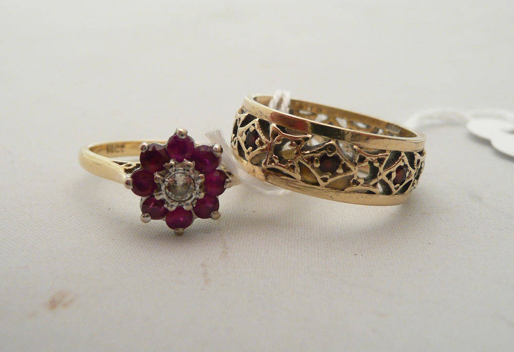 Lot 63 - A diamond and ruby cluster ring stamped '18CT' and a 9ct gold garnet eternity ring