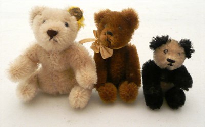 Lot 72 - Miniature Schuco Panda bear, 7cms, miniature brown Schuco bear, 9cms and a Steiff seated...