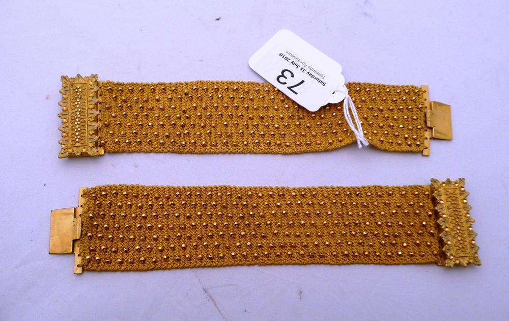 Lot 73 - 19th century yellow fabric choker/pair of bracelets with gilt metal bead decoration and clasps