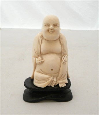 Lot 74 - Carved ivory figure of a seated Buddha