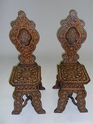 Lot 1436 - A Pair of 19th Century Walnut and Bone Inlaid Sgabello Chairs, the shaped backs and boarded...