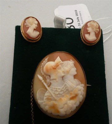 Lot 80 - A carved cameo brooch in base metal and a pair of cameo earrings