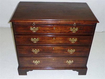 Lot 1437 - A George III Mahogany Chest of Drawers, the rectangular top with moulded edge above a brushing...