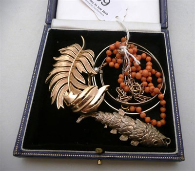 Lot 89 - Two gold bracelets, a coral necklace, silver jewellery, Trifari brooch and costume jewellery