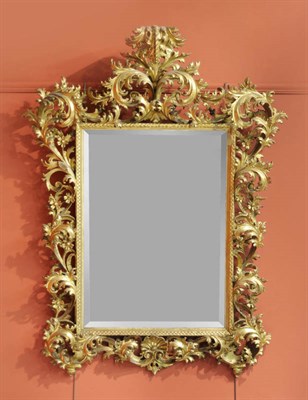 Lot 1441 - A Rococo Style Giltwood and Gesso Wall Mirror, early 19th century, the rectangular bevelled...