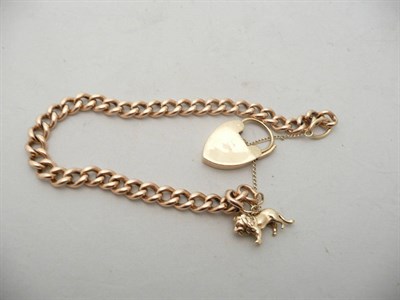 Lot 167 - 9ct gold curb link bracelet with padlock fastener and lion charm