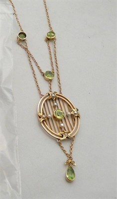 Lot 169 - Pendant on chain set with peridot stones and seed pearls
