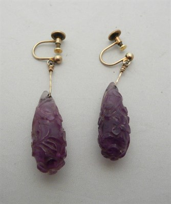 Lot 174 - Pair of carved amethyst earrings