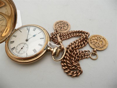 Lot 175 - A gold plated pocket watch and a 9ct gold chain, 42g, hung with two fobs