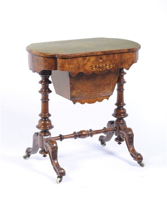 Lot 1448 - A Victorian Walnut and Marquetry Sewing Table, the shaped top opening to reveal a fitted...