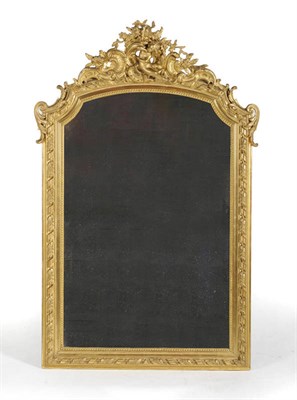 Lot 1450 - A Carved Giltwood and Gesso Wall Mirror, mid 19th century, the beaded and moulded frame with...