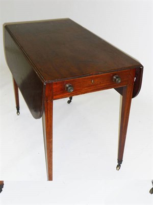 Lot 1453 - A George III Mahogany Pembroke Table, the rectangular top with reeded edge and two rounded drop...