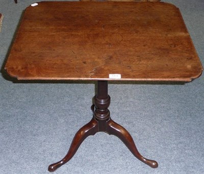 Lot 1454 - A George III Mahogany Pedestal Wine Table, the rounded rectangular top raised on a tapering bulbous